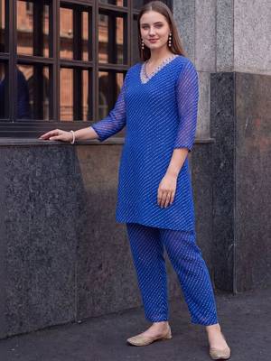 women leheriya dyed regular thread work kurti with trousers 4