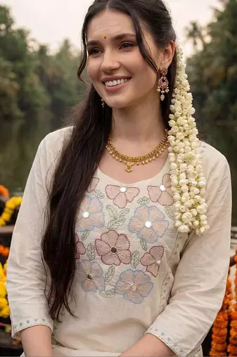 women floral embroidered regular sequinned cotton kurta with trousers