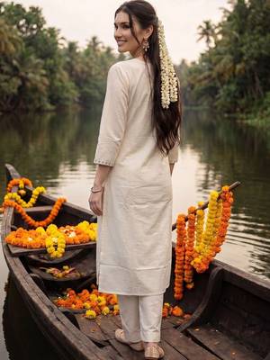 women floral embroidered regular sequinned cotton kurta with trousers 4