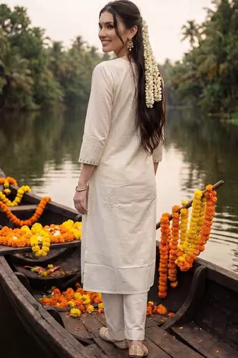 women floral embroidered regular sequinned cotton kurta with trousers