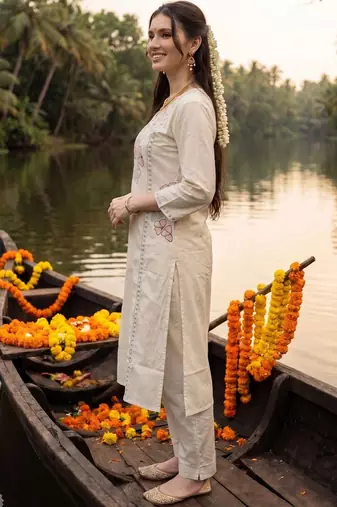 women floral embroidered regular sequinned cotton kurta with trousers