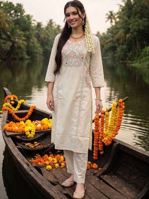 women floral embroidered regular sequinned cotton kurta with trousers 6