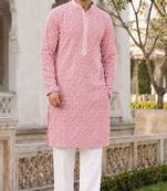 Graceful light peach rayon kurta set with chikankari schiffli work
