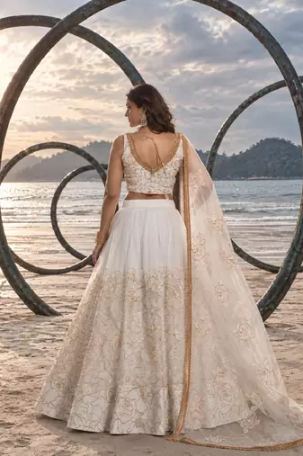 WHITE NET THREAD WITH ZARI AND SEQUIN WORK FESTIVE LEHENGA CHOLI