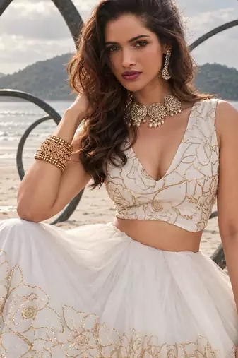 WHITE NET THREAD WITH ZARI AND SEQUIN WORK FESTIVE LEHENGA CHOLI