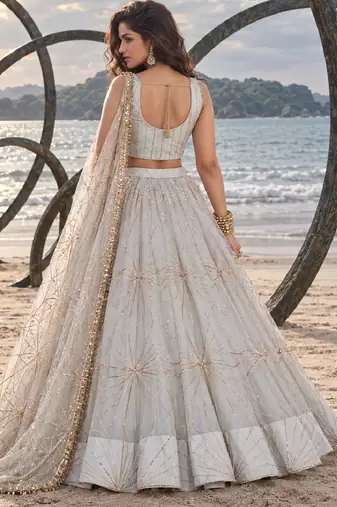 WHITE NET THREAD WITH ZARI AND SEQUIN WORK FESTIVE LEHENGA CHOLI