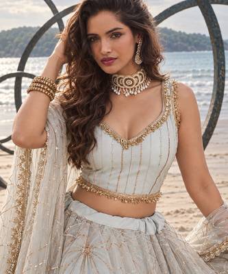 WHITE NET THREAD WITH ZARI AND SEQUIN WORK FESTIVE LEHENGA CHOLI 5