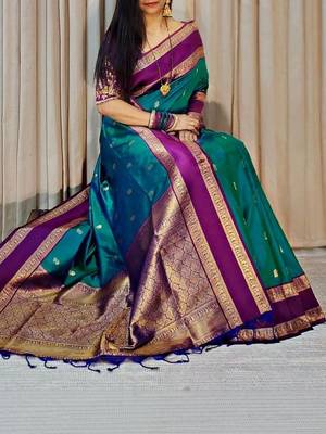 Green woven design silk blend designer kanjeevaram saree 3