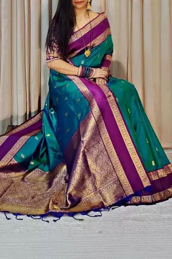 Green woven design silk blend designer kanjeevaram saree
