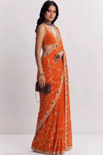 Orange ethnic motifs embroidered satin heavy work saree
