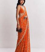 Orange ethnic motifs embroidered satin heavy work saree