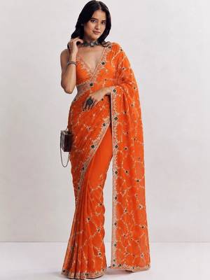 Orange ethnic motifs embroidered satin heavy work saree 3