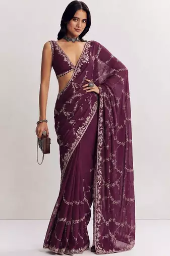Purple ethnic motifs embroidered satin saree