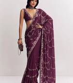 Purple ethnic motifs embroidered satin saree