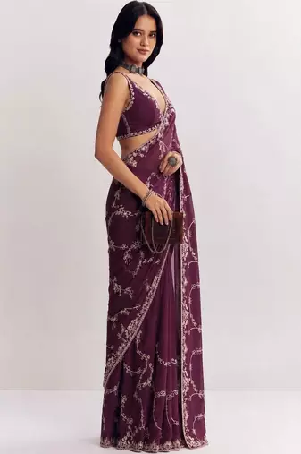 Purple ethnic motifs embroidered satin saree