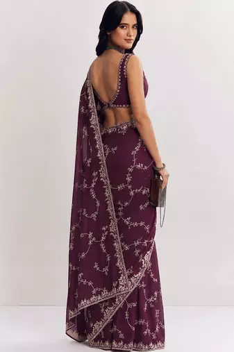 Purple ethnic motifs embroidered satin saree