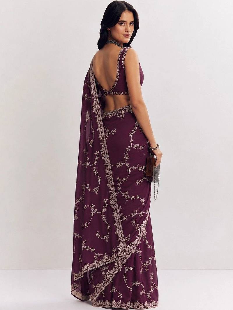 Purple ethnic motifs embroidered satin saree