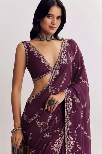 Purple ethnic motifs embroidered satin saree