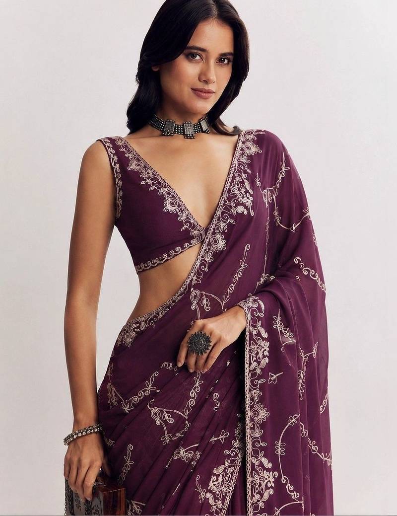 Purple ethnic motifs embroidered satin saree