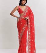 Red ethnic motifs embroidered satin heavy work saree