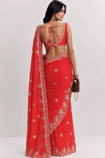 Red ethnic motifs embroidered satin heavy work saree