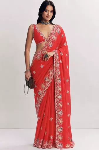 Red ethnic motifs embroidered satin heavy work saree