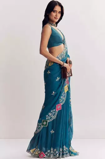 Teal ethnic motifs embroidered satin designer saree