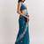 Teal ethnic motifs embroidered satin designer saree