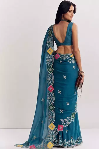 Teal ethnic motifs embroidered satin designer saree