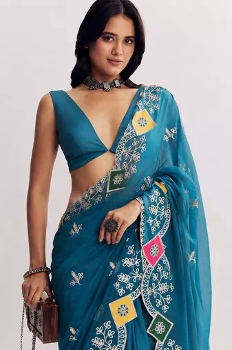 Teal ethnic motifs embroidered satin designer saree