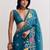 Teal ethnic motifs embroidered satin designer saree