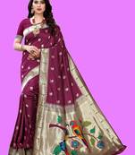 Purple purple paithani woven design saree and has a zari border blouse piece