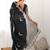 Black embellished embroidered scallop tissue saree with unstiched blouse piece