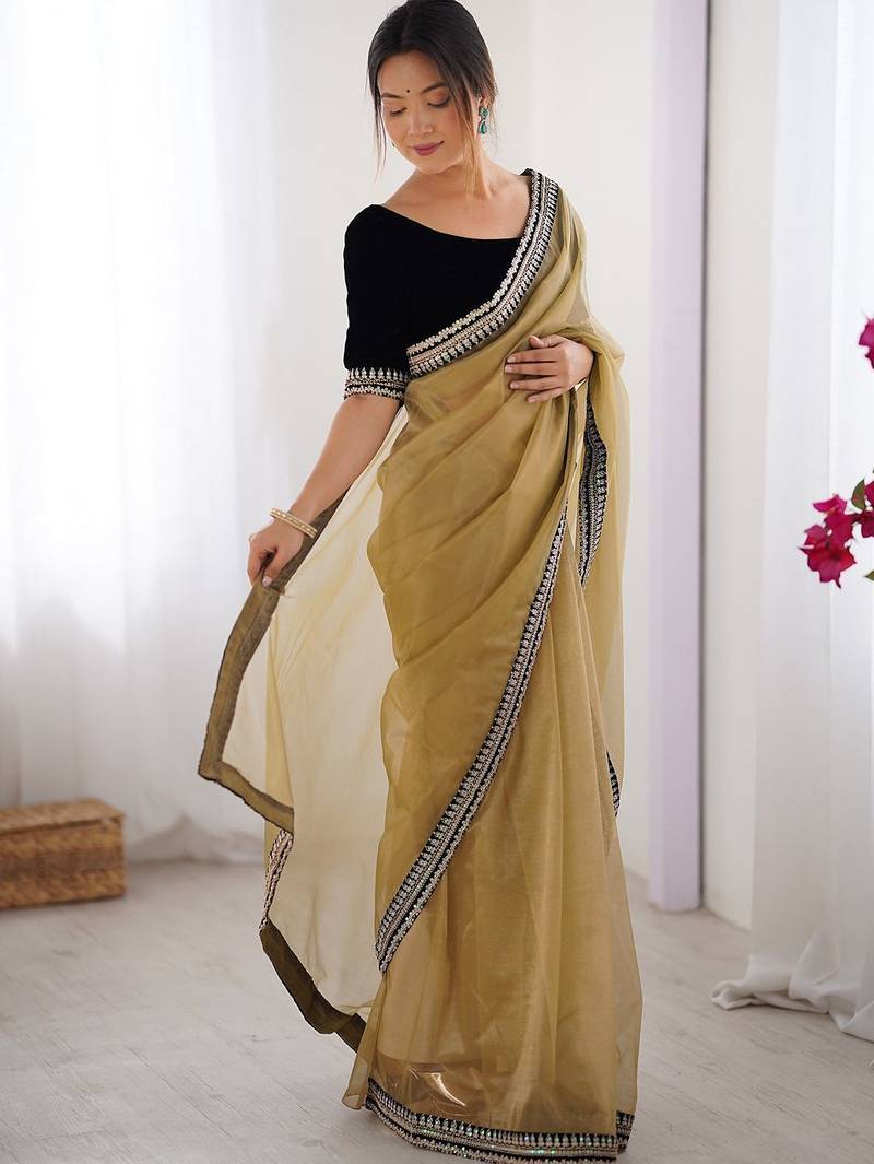 Mustard embroidered sequinned border net saree