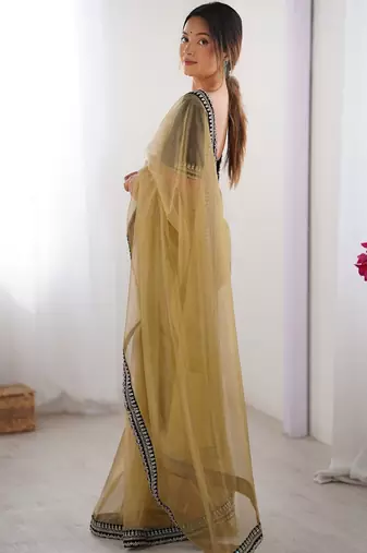 Mustard embroidered sequinned border net saree