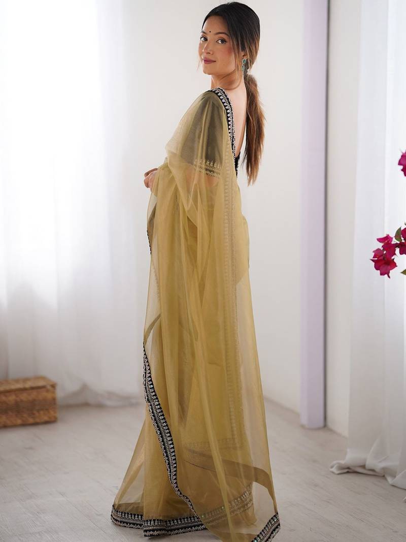 Mustard embroidered sequinned border net saree