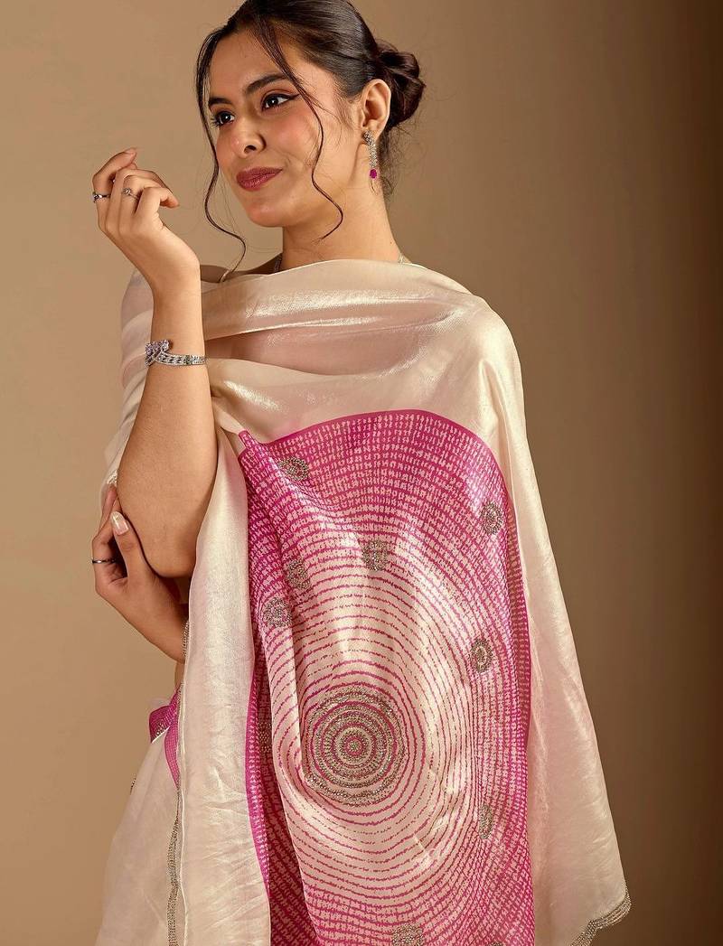 Cream polka dot embroidered organza saree