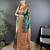 Green ethnic motifs woven design zari banarasi saree