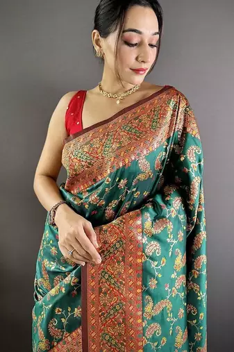 Green ethnic motifs woven design zari banarasi saree