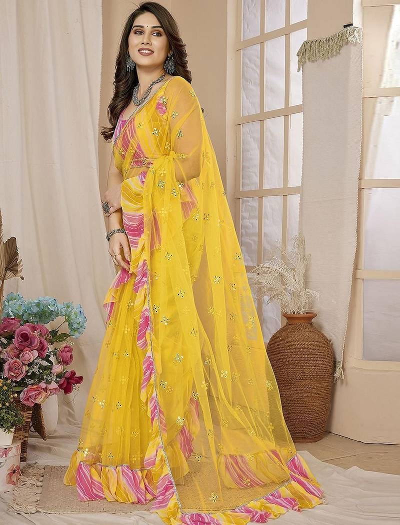 Yellow embellished mirror work net ruffle saree with blouse piece