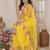 Yellow embellished mirror work net ruffle saree with blouse piece