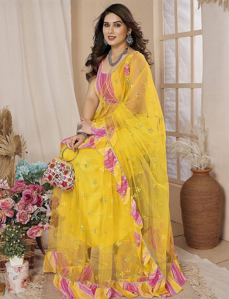 Yellow embellished mirror work net ruffle saree with blouse piece