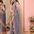 Grey embellished mirror work ruffle net saree