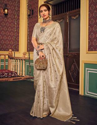 Cream ethnic woven design zari saree 1