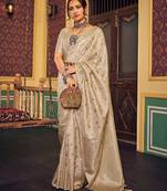 Cream ethnic woven design zari saree