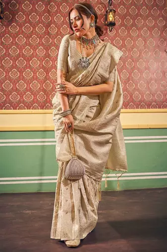 Cream ethnic woven design zari saree