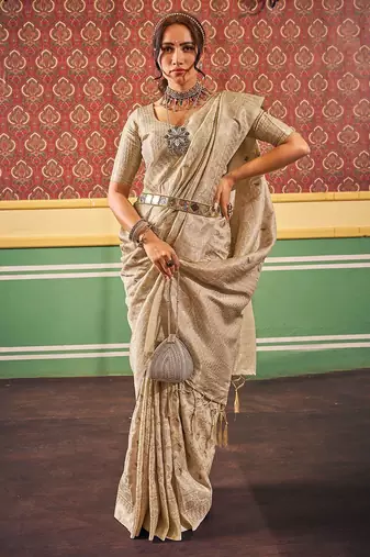 Cream ethnic woven design zari saree