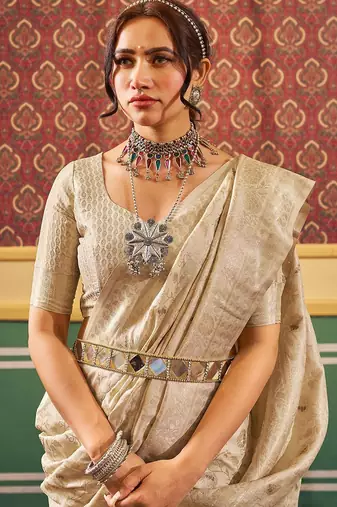 Cream ethnic woven design zari saree
