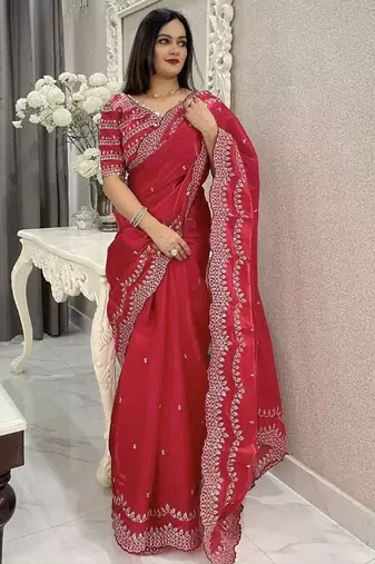 Red ethnic motifs embroidered silk blend saree