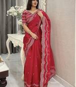 Red ethnic motifs embroidered silk blend saree